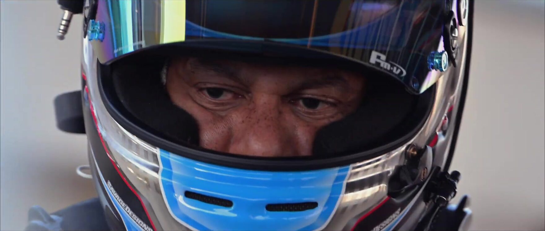 Close-up of a driver's helmet and visor before going out on track